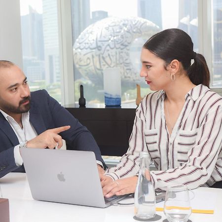 Nassima Tower Hotel Apartments Dubai Exterior photo A meeting between a financial advisor and a client