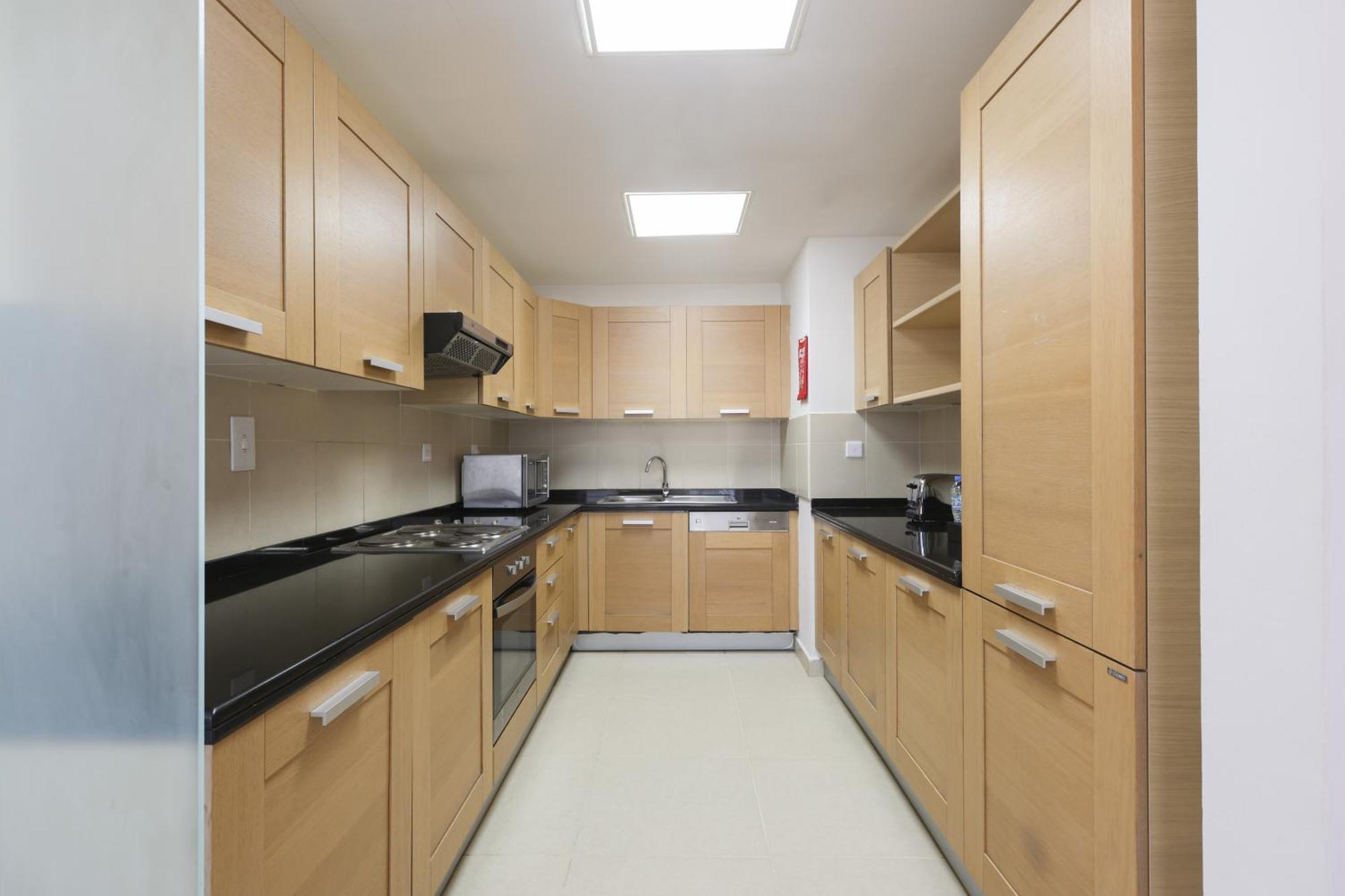 Nassima Tower Hotel Apartments Dubai Exterior photo A typical kitchen in a residential hall