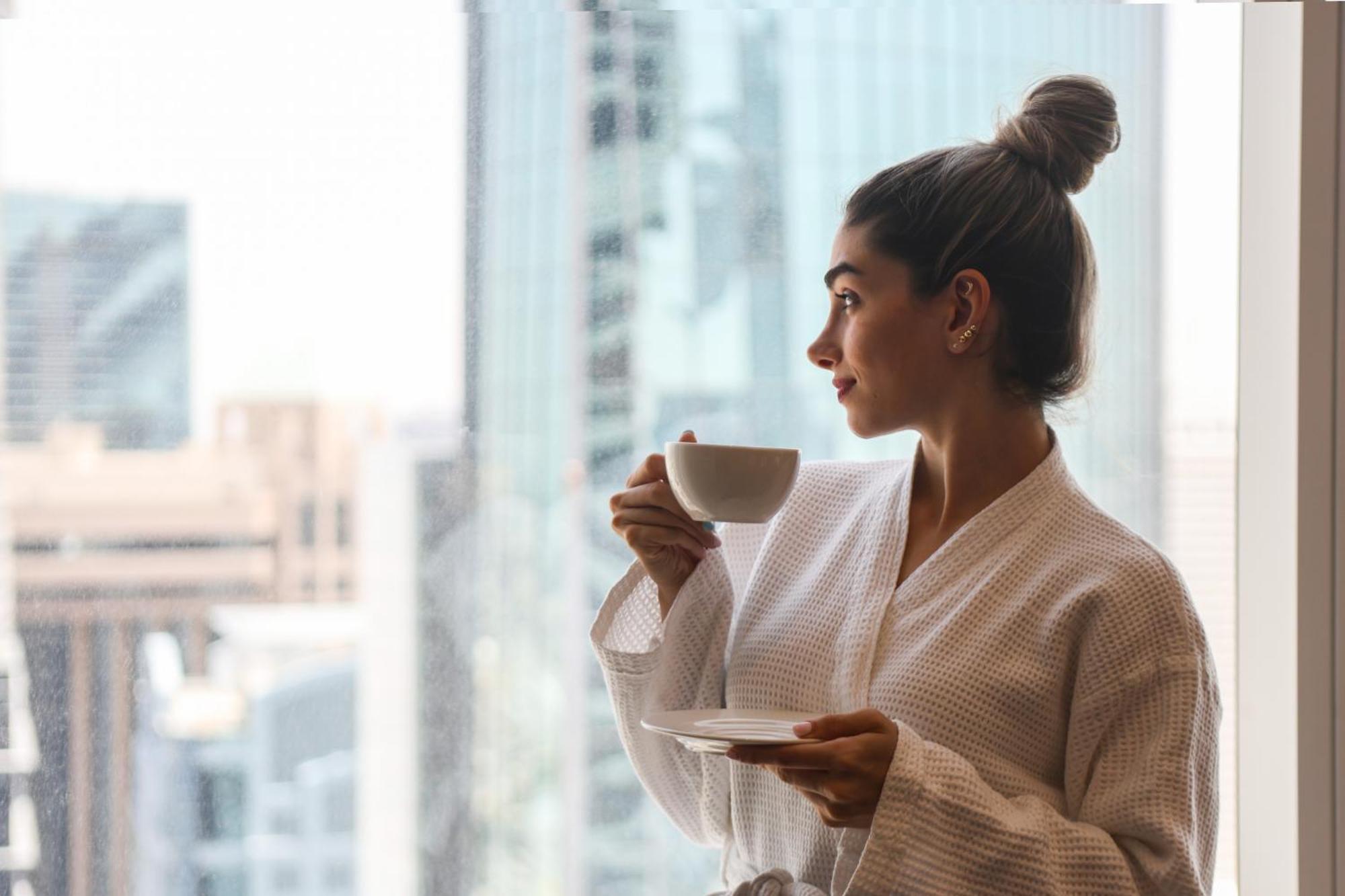 Nassima Tower Hotel Apartments Dubai Exterior photo A woman wearing a bathrobe
