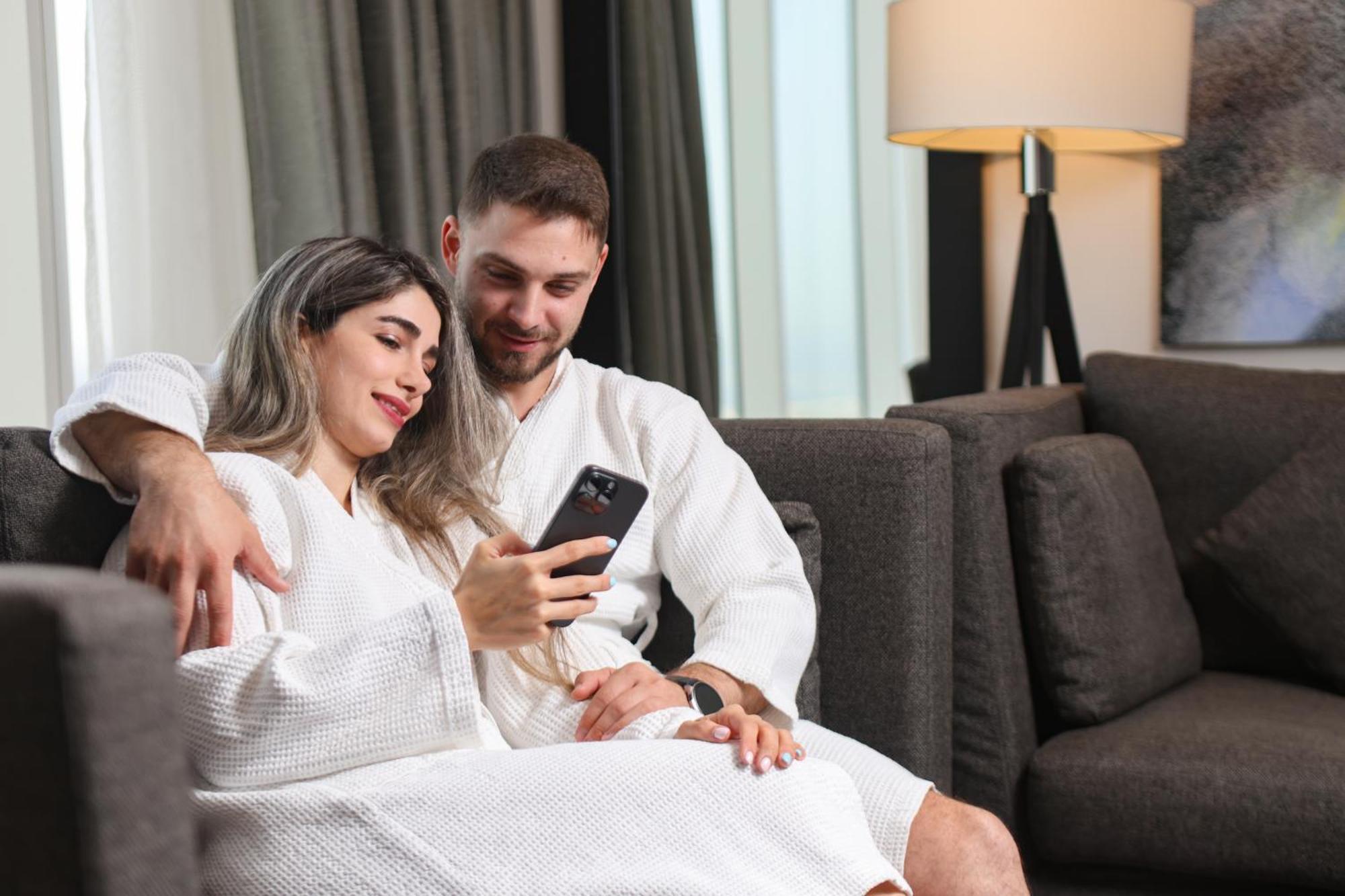Nassima Tower Hotel Apartments Dubai Exterior photo A couple wearing bathrobes